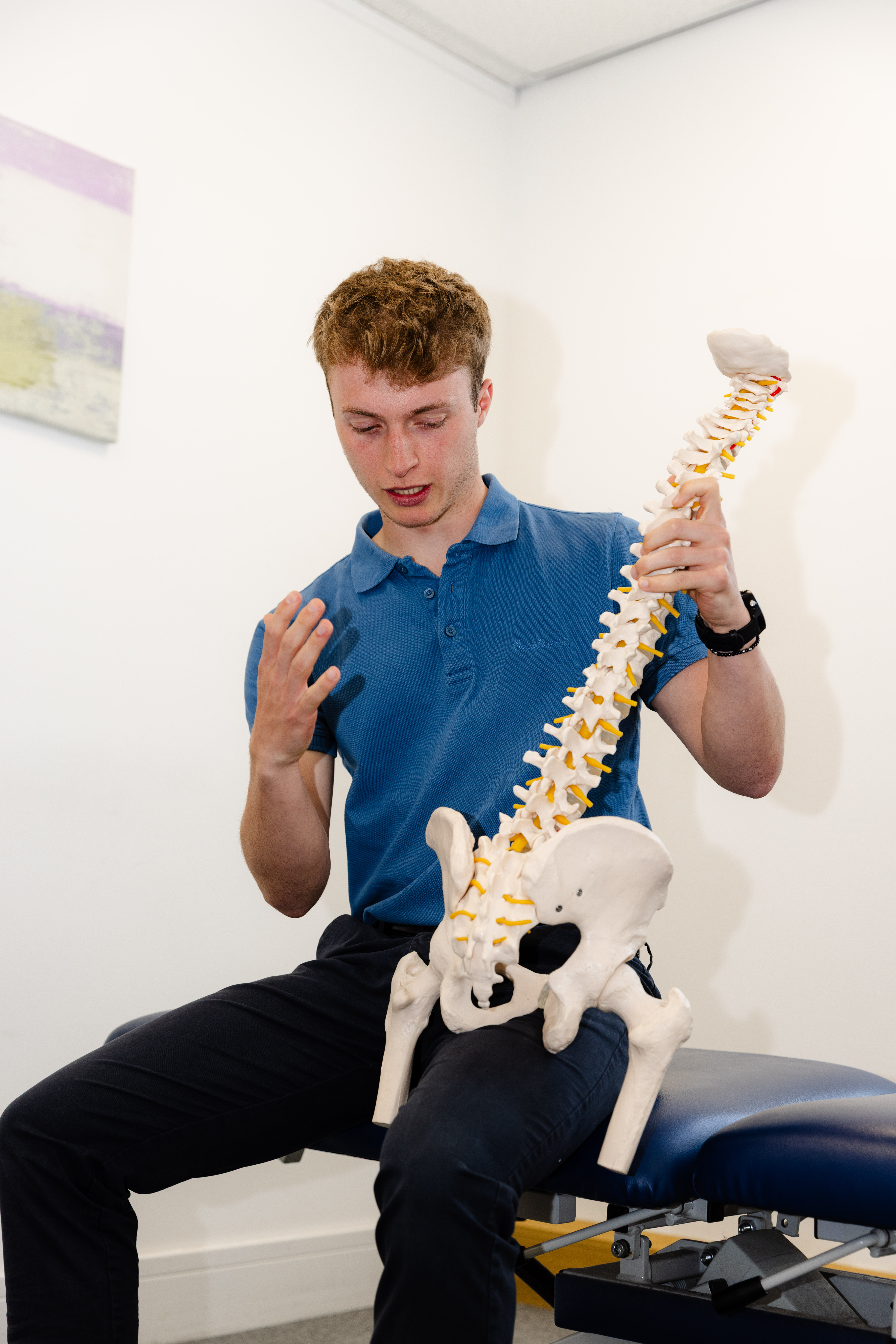 Jordan Rumbles explaining chiropractic care